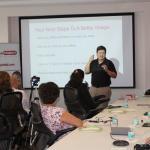 Carlos Garcia of Please Hold Advertising speaks at Lunch & Learn event in Miami, FL.